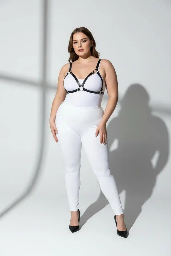 black faux leather o-ring chest harness with slim 1 cm straps and silver center ring worn over white outfit