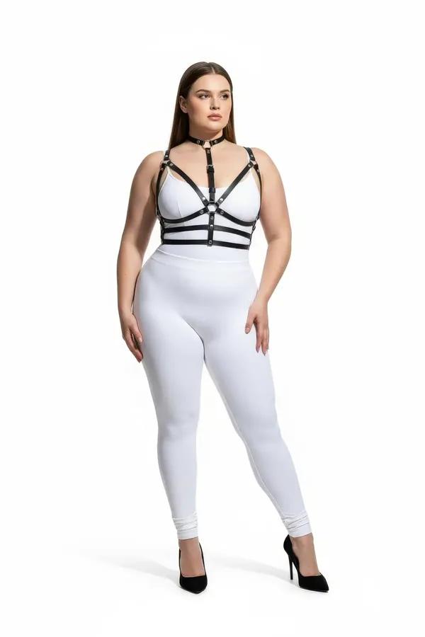black faux leather strappy choker harness bra with silver O-ring center and multi-strap underbust bands worn on plus-size mod