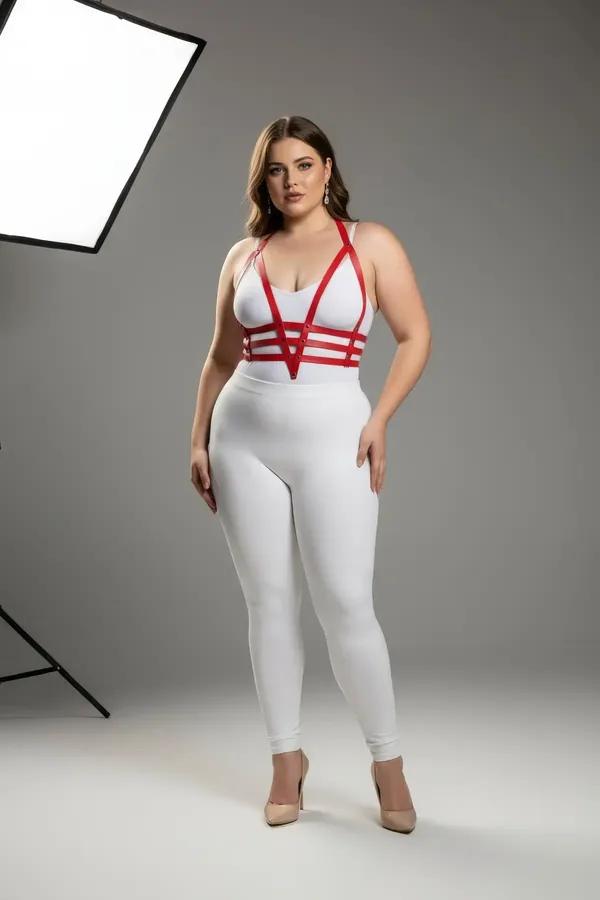 red faux leather strappy body harness with four horizontal chest bands and silver hardware worn by plus-size model