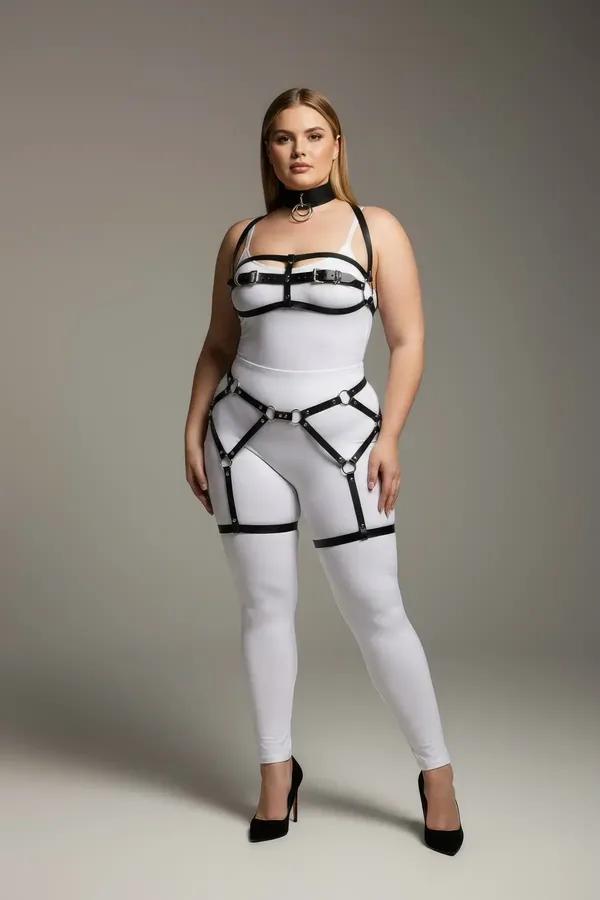 Black faux leather full body harness with silver O-ring choker, chest straps, waist panel, and thigh garter bands on plus-siz