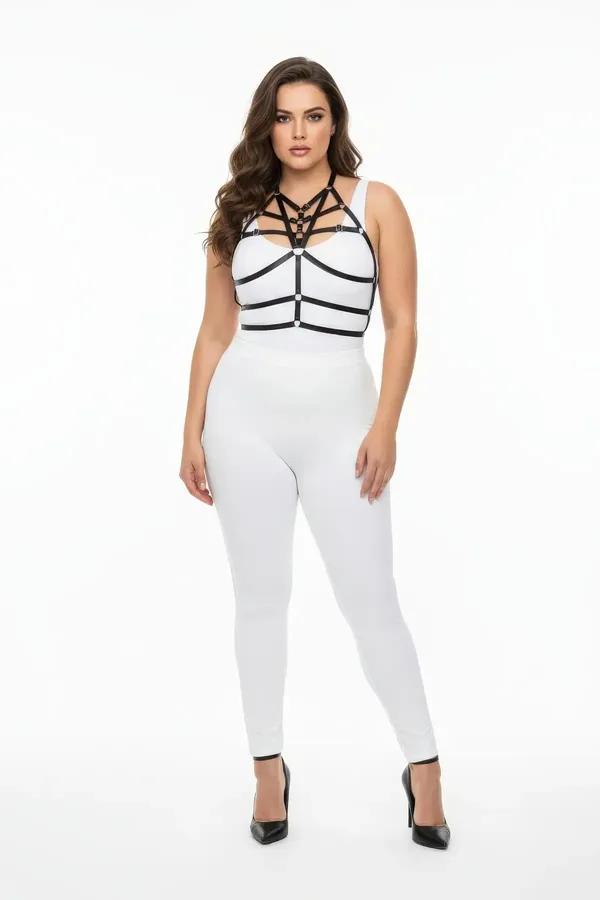 black faux leather caged chest harness with multi-strap cage and gold O-ring worn over white bodysuit