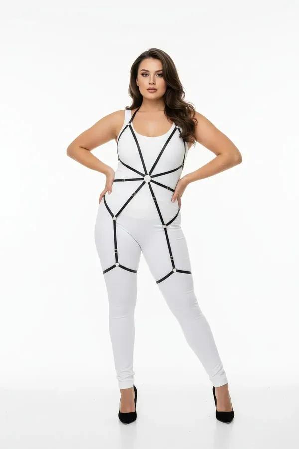 Black faux leather full body harness with gold O-ring chest detail and thigh strap cages worn over white bodysuit