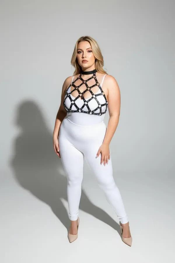Black vegan leather geometric cage chest harness with gold stud hardware and integrated choker band, diamond lattice design