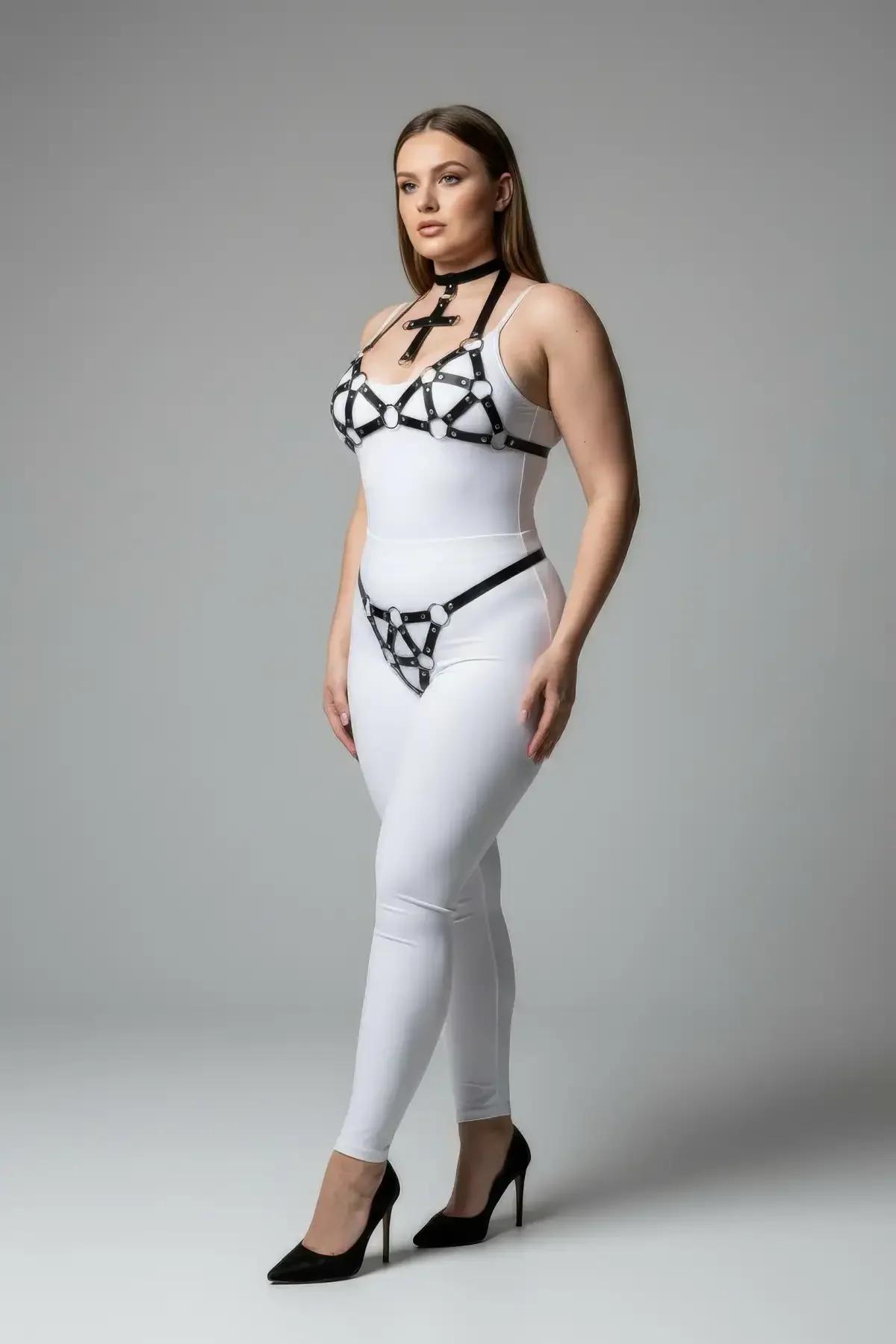 Black faux leather 3-piece harness set with cross choker, geometric silver O-ring chest harness, and hip G-string worn over w