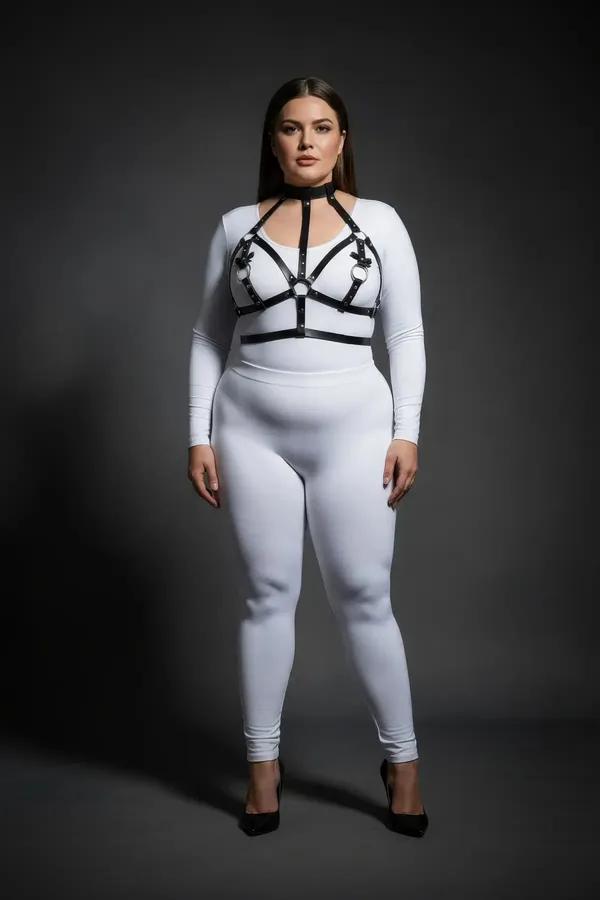black faux leather strappy chest harness with choker neck collar and silver O-ring center worn over white top