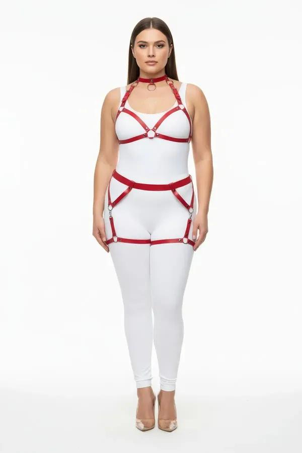 Red faux leather full body harness with silver O-ring choker, chest frame, and thigh garter straps on plus-size model