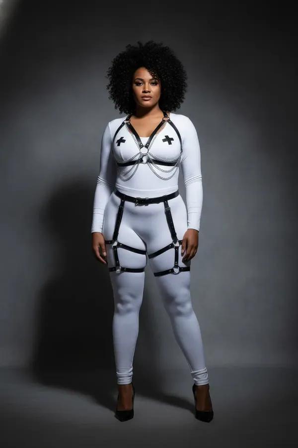 black vegan leather body harness and leg garter set with silver chain draping and cage thigh straps on model