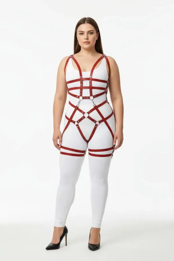 Claret red full body harness with silver O-rings and double thigh straps worn over white bodysuit, front view