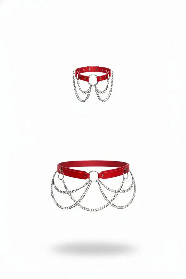 red faux leather waist harness with central O-ring and five cascading silver chain drapes on white background