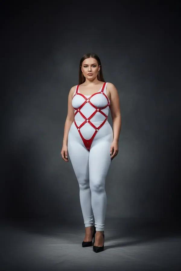 red vegan leather full body harness with diamond lattice and silver O-ring hardware worn on plus-size model