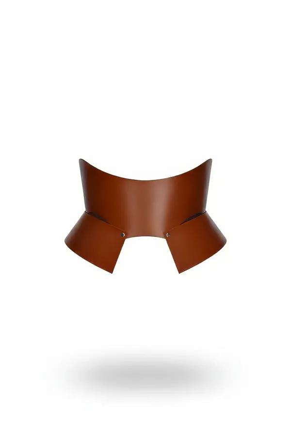 tan faux leather waist cinch harness with sculptural flared hip panels and silver stud closure front view