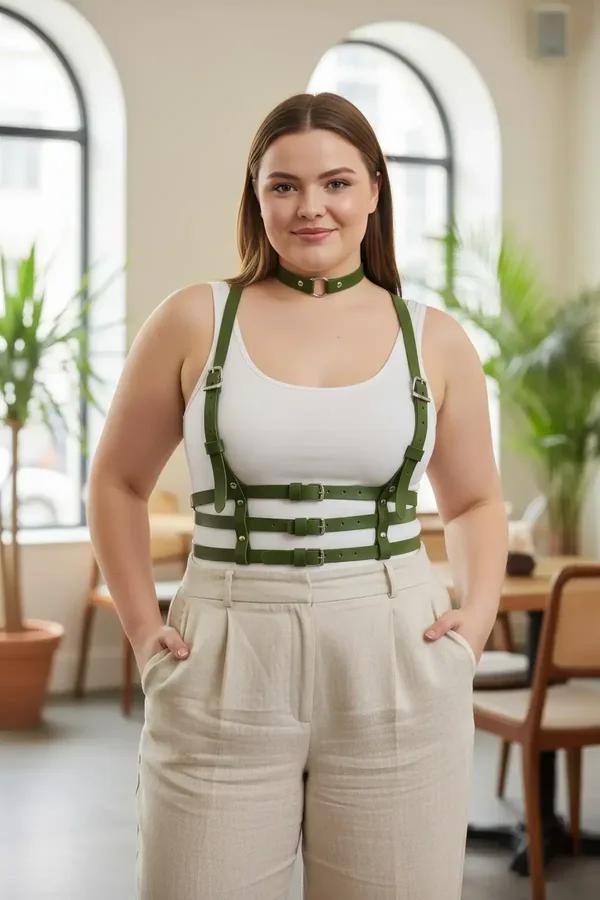 Olive green faux leather chest harness with matching choker and three silver buckle waist straps worn over white tank top