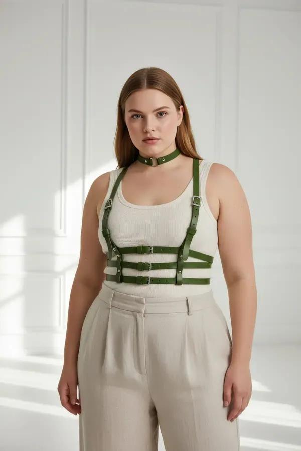 Olive green faux leather chest harness with matching choker and three silver buckle waist straps worn over white tank top