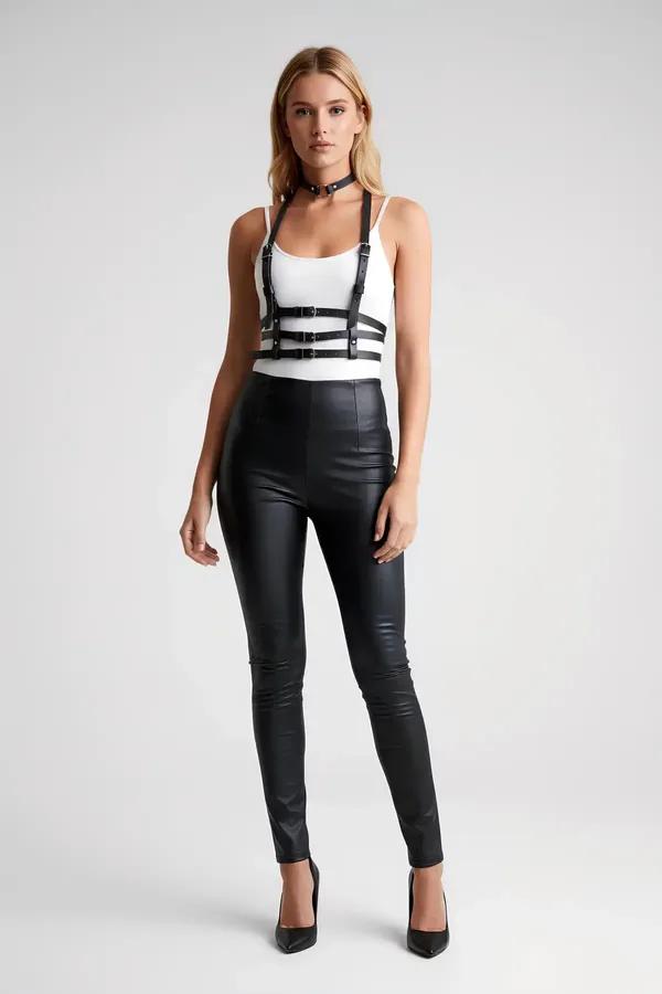 black faux leather multi-strap chest harness with silver buckles and matching choker worn over white top