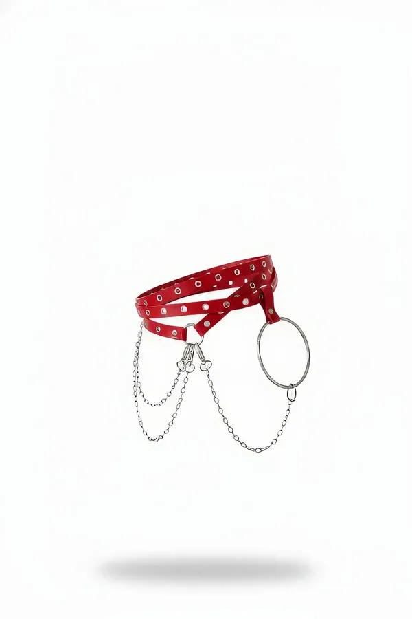 red vegan leather waist harness with silver O-ring and three draped chain links on white background