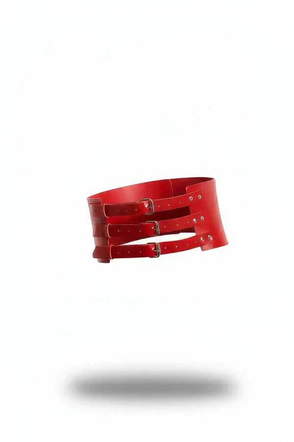 red wide faux leather waist harness with three gunmetal rectangular buckle straps and curved corset panel