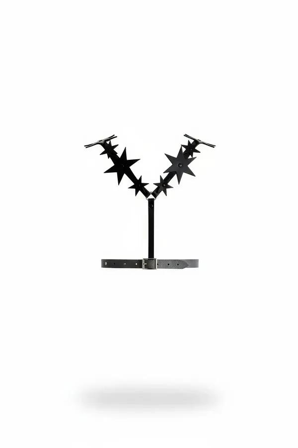 black faux leather star chest harness with seven-point star cutout arms and silver pin-buckle underbust belt on white backgro