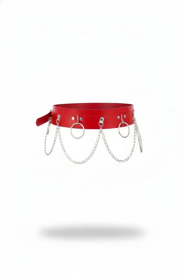 red faux leather waist harness with three silver O-rings and draping oval-link chains on white background