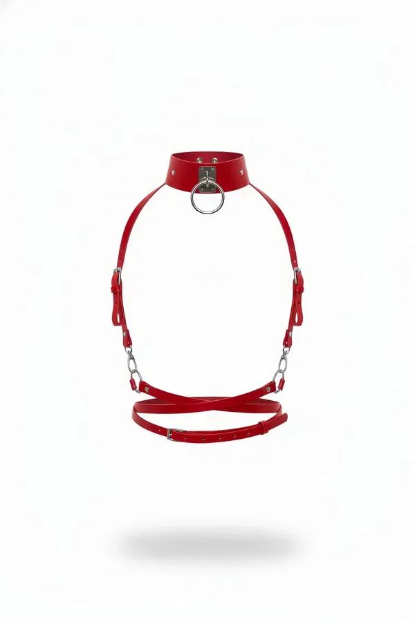 Red faux leather body harness with silver O-ring choker, link chains across chest, and crossed waist strap
