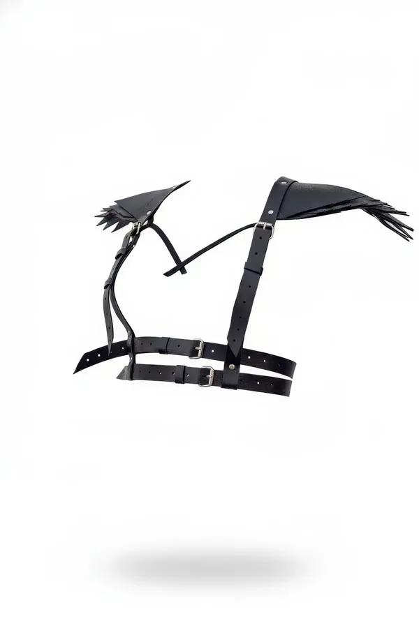 black faux leather chest harness with winged shoulder panels fringe trim and silver buckles front view