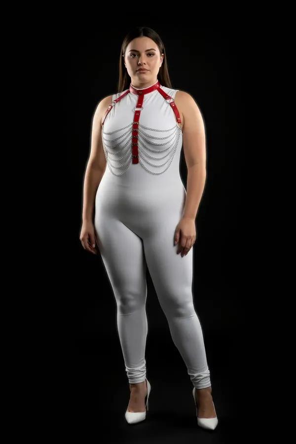 red faux leather body harness with cascading silver chain rows and adjustable choker collar on plus size model