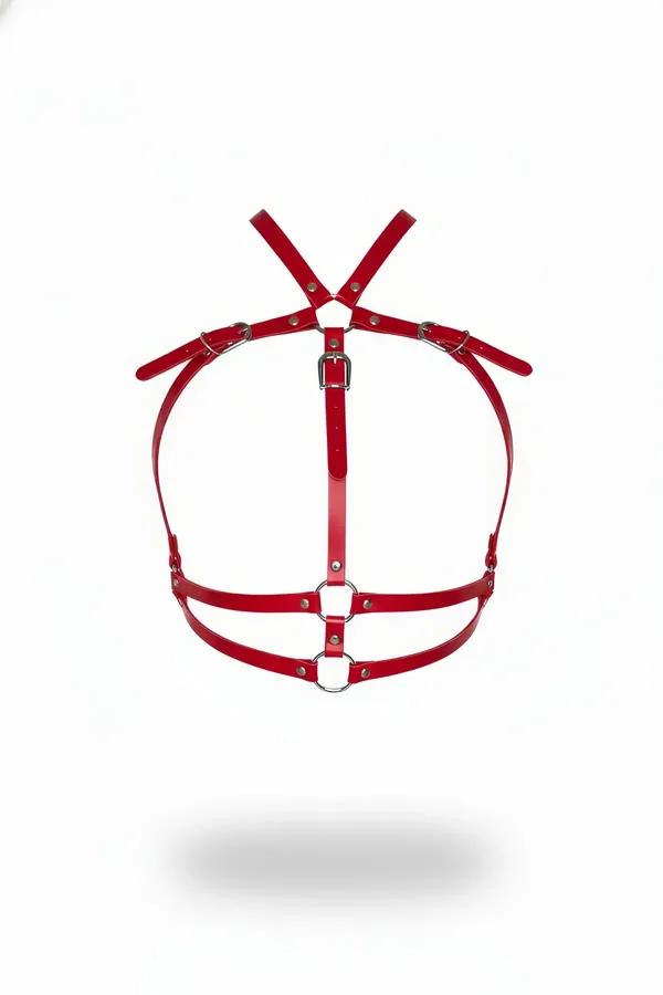 Red faux leather chest harness with dual silver O-rings and adjustable rectangular buckles, X-back strap configuration