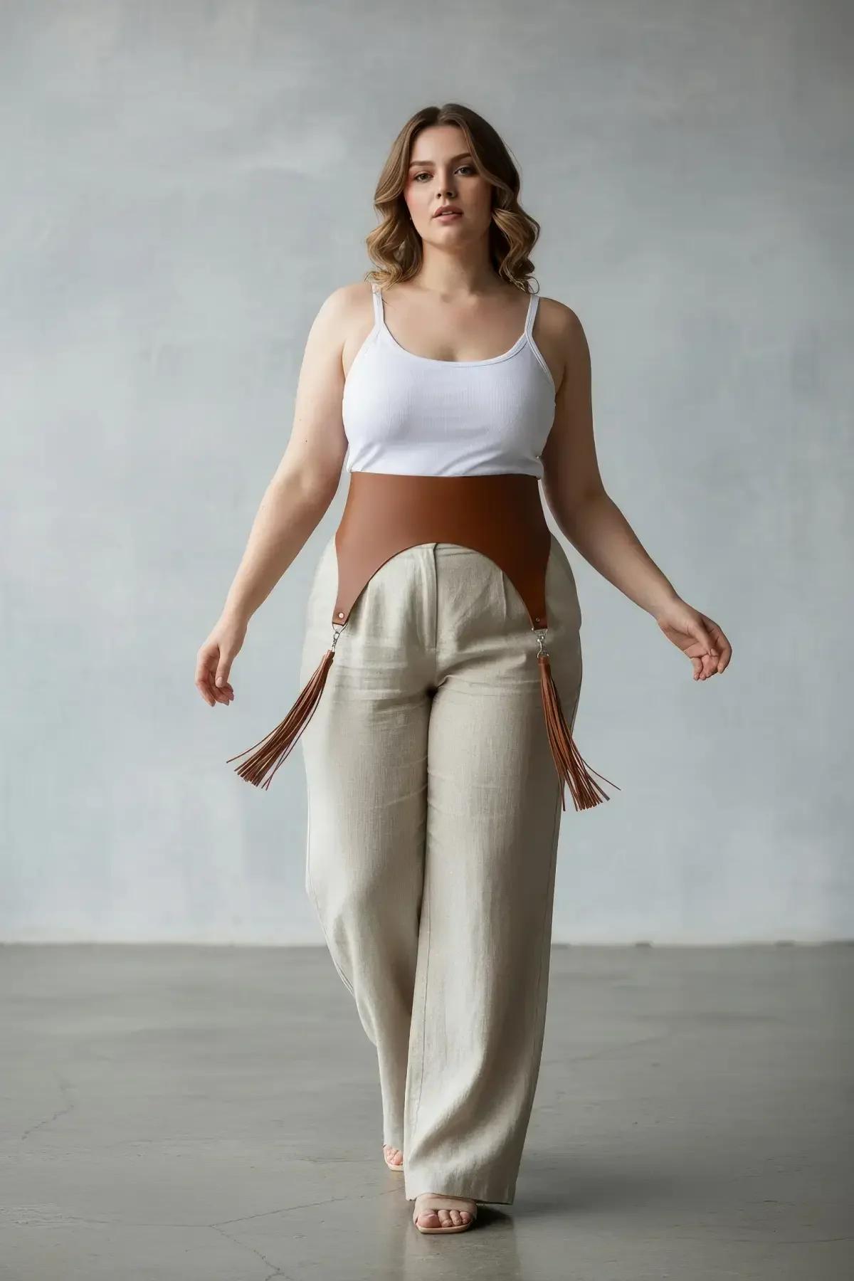 tan faux leather wide waist harness with fringe tassel garter details and silver clip hardware