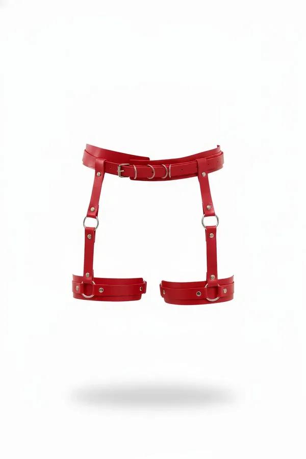Red faux leather garter harness with silver O-rings and wide waistband connected to dual adjustable thigh bands