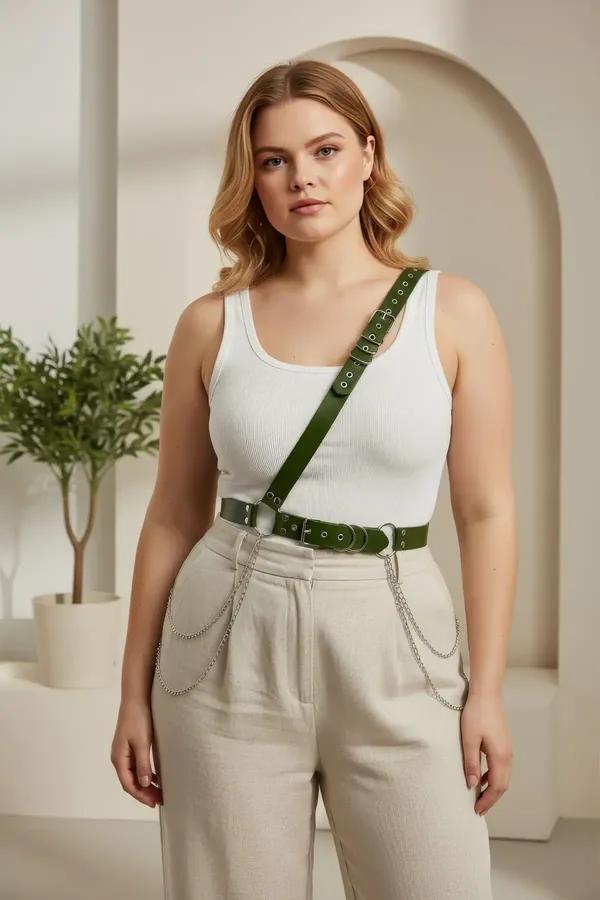 dark green faux leather body harness diagonal chest strap waist belt silver chains worn over white tank