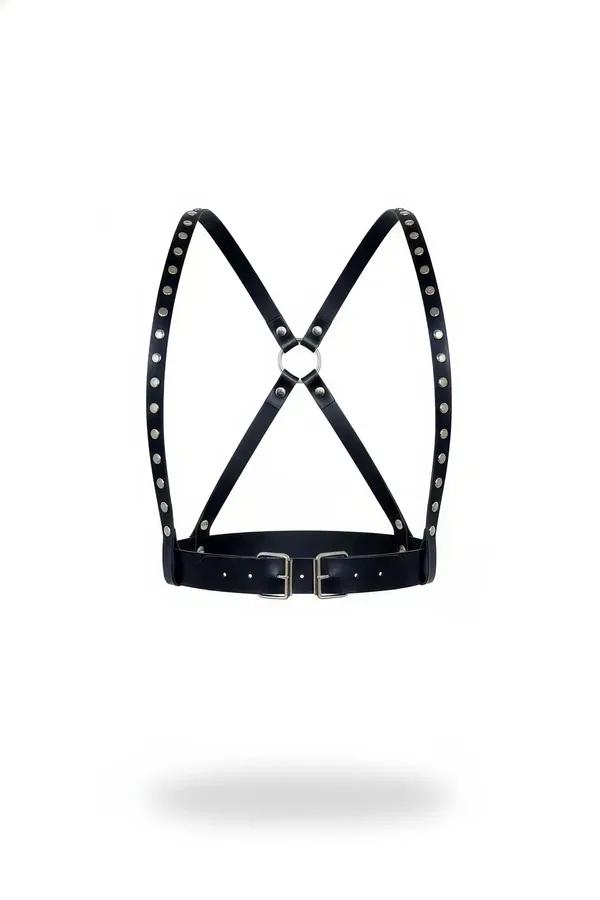 black faux leather chest harness with silver dome studs and X-back crossing straps, dual waist buckles and front O-ring, whit