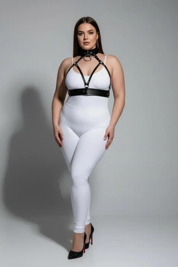 black faux leather o-ring choker and chest harness set with gold hardware worn over white bralette plus size model