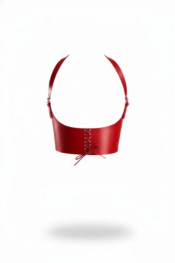 Red faux leather underbust harness with corset lace-up front panel, metal eyelets, red bow tie, and silver adjustable shoulde