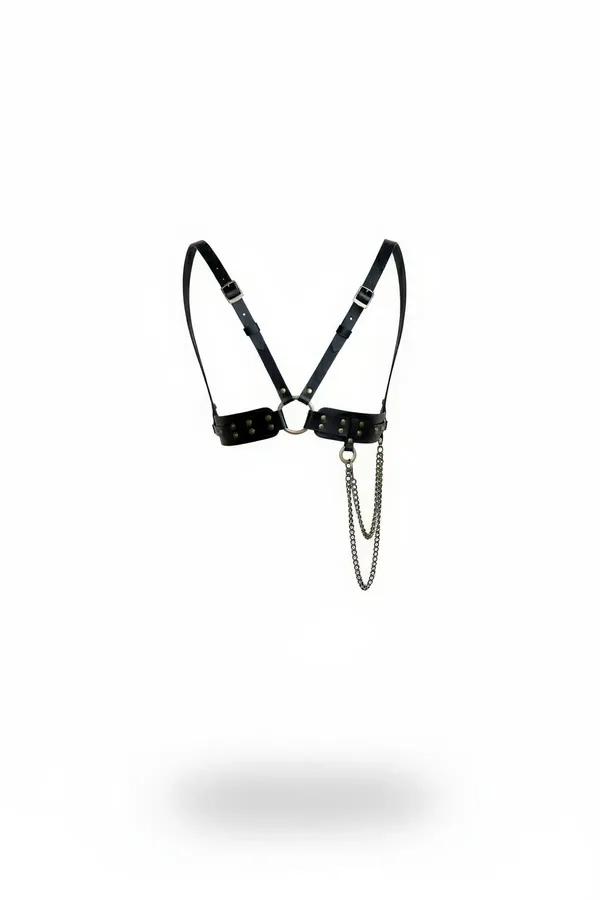 black faux leather chest harness with silver pyramid studs, O-ring center, and double-drape silver chain detail