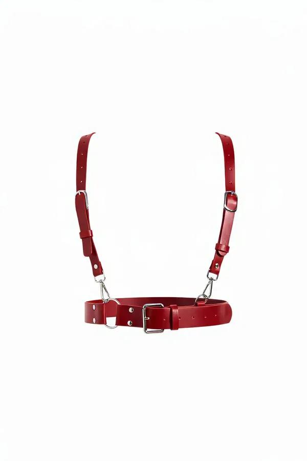 red faux leather waist belt harness with adjustable shoulder straps and silver-tone buckles on white background