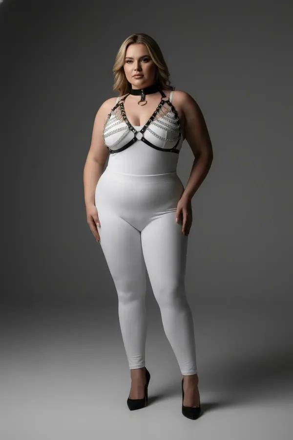 black faux leather chain detail chest harness with silver O-ring and matching choker collar on plus-size model