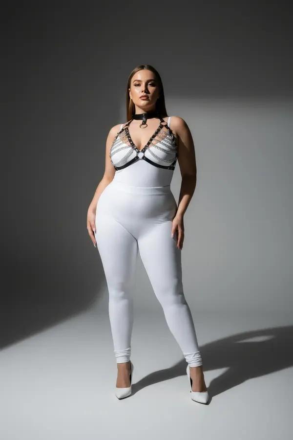 black faux leather chain detail chest harness with silver O-ring and matching choker collar on plus-size model