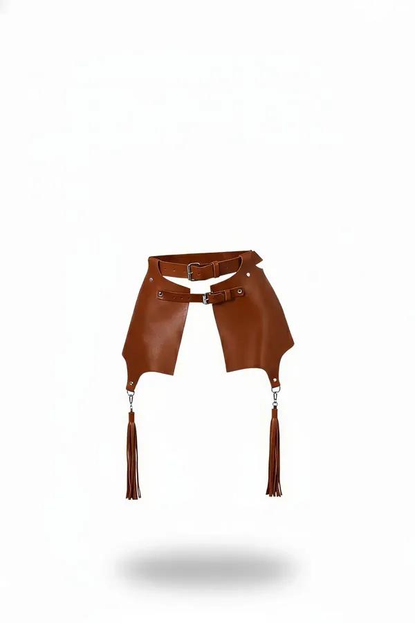 tan faux leather waist harness with wide hip panels silver buckle details and tassel drops