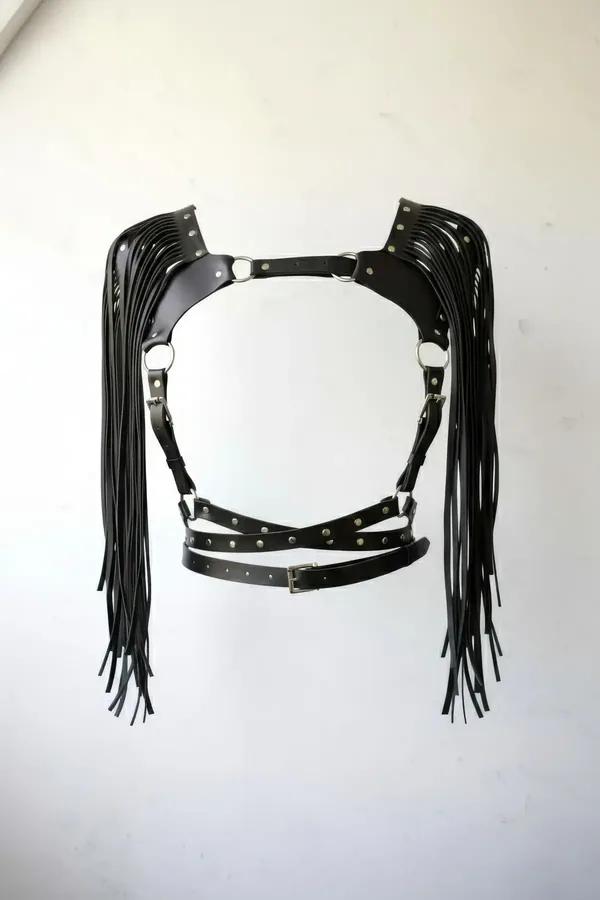 black faux leather chest harness with long shoulder fringe and silver stud accents, criss-cross waist straps
