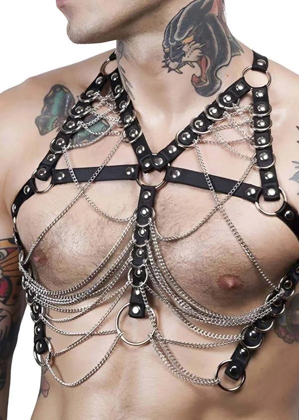 Black faux leather chest harness with silver dome studs and cascading silver link chains on male torso