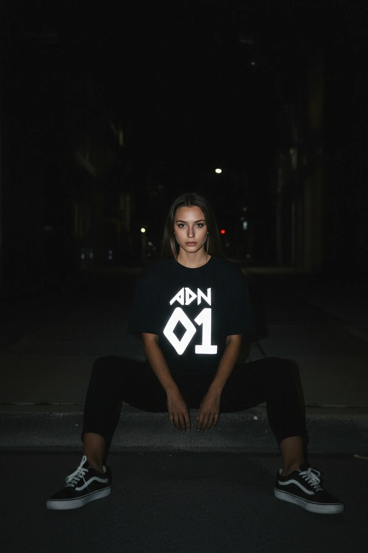 Close-up of reflective graphic detail on black t-shirt