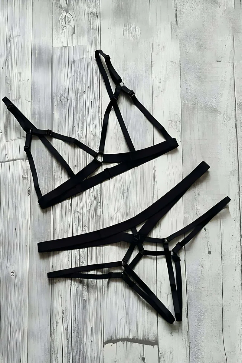 Black geometric lingerie set with strappy bottoms and triangle bra detail