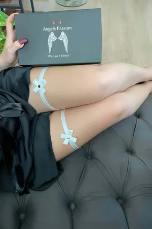 White Thigh Garters with Delicate Satin Bows and Pearl Accents Worn on Model's Legs