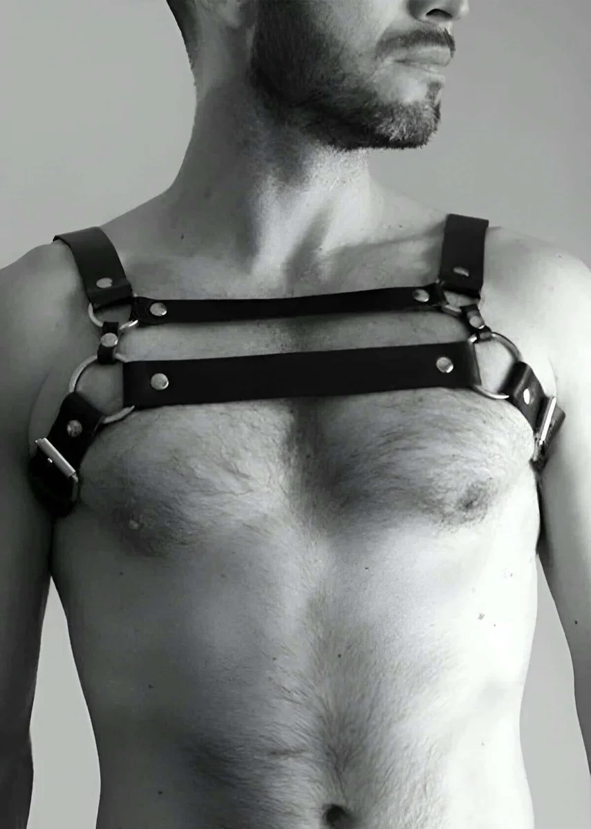 Black leather chest harness fashion accessory on a