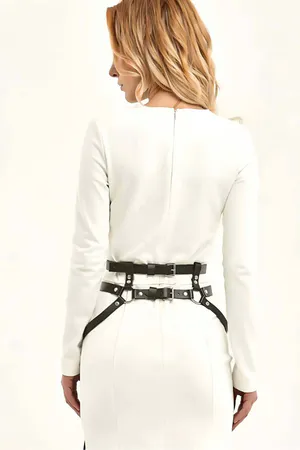Black Faux Leather Waist Harness with Statement Tassels on a Woman Wearing a White Dress