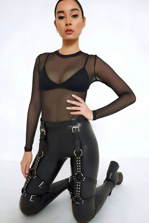 Black Faux Leather Studded Thigh Harness with O-Rings, worn over leggings