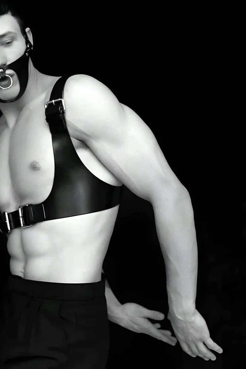 Full body harness with gag mask close-up on O-ring detail.