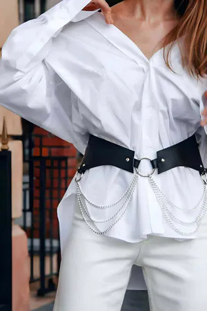 Black Faux Leather Waist Harness Belt with Silver O-Ring and Draped Chains over White Shirt
