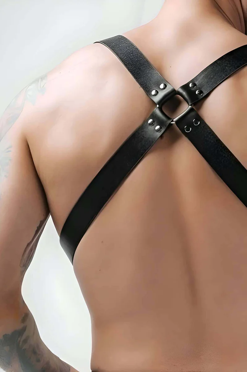 Black adjustable faux leather chest harness, rear