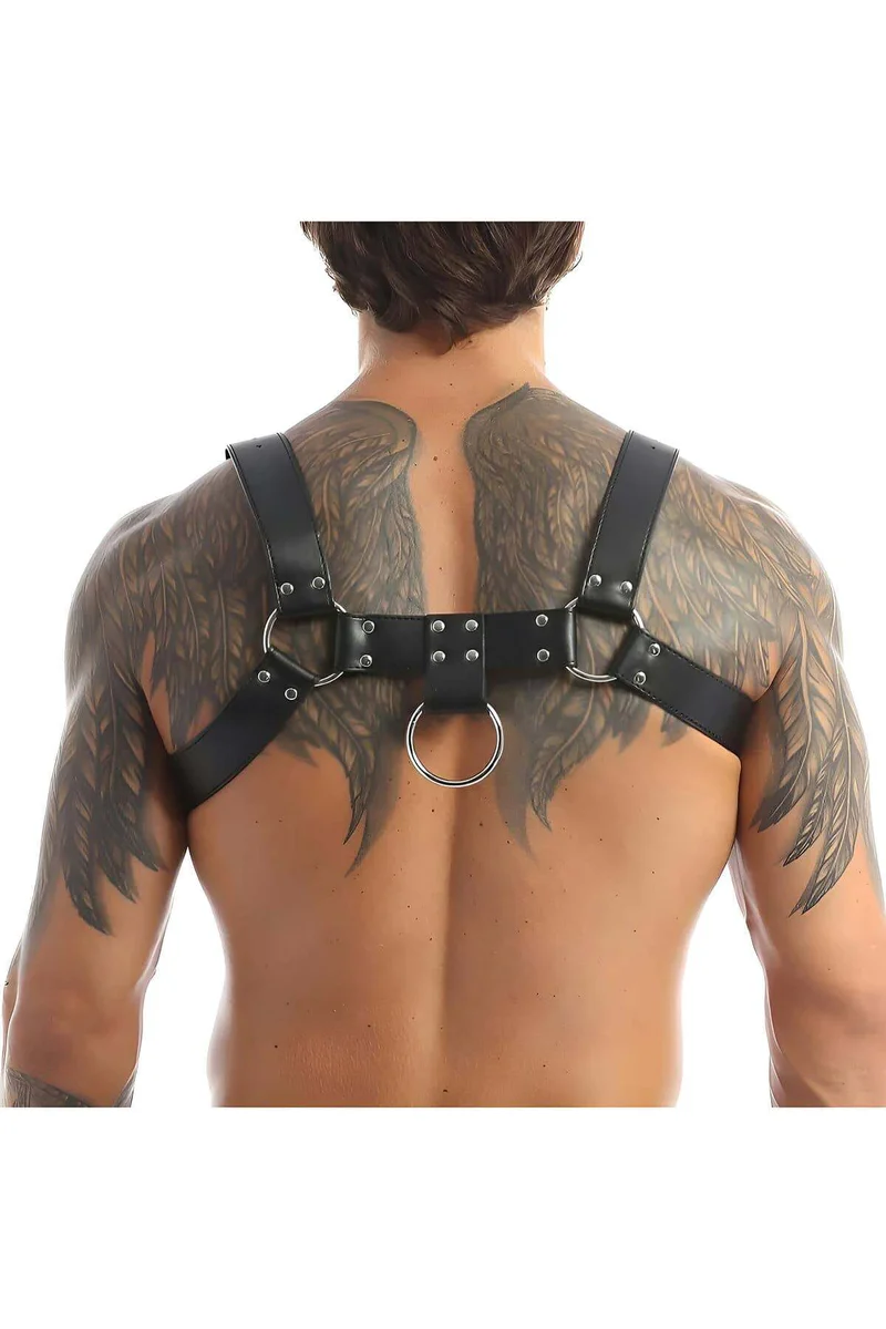 Close-up of black faux leather body harness O-ring and studded detail