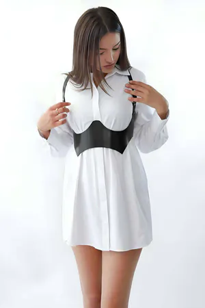 Black Faux Leather Underbust Harness for Women Styled over White Shirt Dress